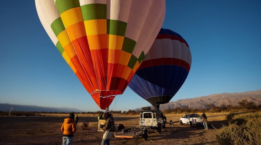 Colorful hot air balloons taking off in Cafayate, Argentina – curated by Wine Tours in Style.