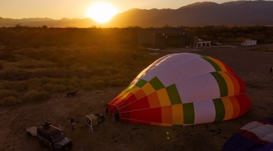 Hot air balloon being prepared at sunrise in Cafayate, Argentina – an exclusive Wine Tours in Style experience.